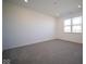 Simple bedroom with grey carpeting and large window at 7920 Magnolia St, New Palestine, IN 46163
