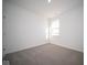 Simple bedroom with neutral carpet and a single window at 7920 Magnolia St, New Palestine, IN 46163