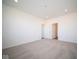 Spacious bedroom with grey carpet and two entry doors at 7920 Magnolia St, New Palestine, IN 46163