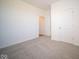 Spacious bedroom with grey carpet and double door closet at 7920 Magnolia St, New Palestine, IN 46163