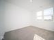 Spacious bedroom with neutral carpet and large window at 7920 Magnolia St, New Palestine, IN 46163