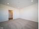Bright bedroom with grey carpet and access to bathroom at 7920 Magnolia St, New Palestine, IN 46163