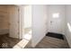 Bright entryway with white doors and wood-look flooring at 7920 Magnolia St, New Palestine, IN 46163