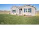 Brick and shingle home with walkway, landscaping, and grassy yard at 7920 Magnolia St, New Palestine, IN 46163