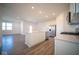 Modern kitchen with island, stainless steel appliances, and white cabinets at 7920 Magnolia St, New Palestine, IN 46163
