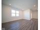 Spacious living room with vinyl flooring and large windows at 7920 Magnolia St, New Palestine, IN 46163