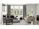 Relaxing living room with a fireplace and plenty of natural light at 5710 Cloister Ln, McCordsville, IN 46055