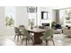Elegant dining room with a modern wood table and green chairs at 5710 Cloister Ln, McCordsville, IN 46055