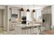 Modern kitchen with light cabinets, double oven, and large island at 5710 Cloister Ln, McCordsville, IN 46055