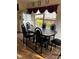 Dining area with a table and six chairs, plus a window at 1449 Danielle Dr, Indianapolis, IN 46231