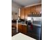 Kitchen features stainless steel refrigerator and wood cabinets at 1449 Danielle Dr, Indianapolis, IN 46231