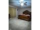 Large bedroom with carpeted floors and ceiling fan at 1449 Danielle Dr, Indianapolis, IN 46231