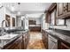 Open concept kitchen with island, stainless steel appliances, and tile flooring at 814 E 23Rd St, Indianapolis, IN 46205
