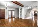 Spacious living room with hardwood floors and a staircase at 814 E 23Rd St, Indianapolis, IN 46205