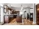 Spacious kitchen with dark wood cabinets, granite counters, and stainless steel appliances at 814 E 23Rd St, Indianapolis, IN 46205