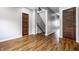 Bright hallway with hardwood floors and classic doors leading to other rooms at 814 E 23Rd St, Indianapolis, IN 46205