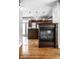 Kitchen with dark wood cabinets and a fireplace at 814 E 23Rd St, Indianapolis, IN 46205
