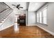 Living room with hardwood floors, fireplace and staircase at 814 E 23Rd St, Indianapolis, IN 46205