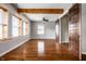 Spacious living room with hardwood floors, a fireplace, and large windows at 814 E 23Rd St, Indianapolis, IN 46205
