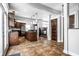 View of kitchen with island, dark wood cabinets, and tile floor at 814 E 23Rd St, Indianapolis, IN 46205