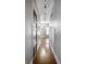 Long hallway with hardwood floors and classic wooden doors at 814 E 23Rd St, Indianapolis, IN 46205