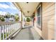 Inviting front porch with white railings and view of the street at 814 E 23Rd St, Indianapolis, IN 46205