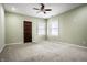 Light and airy bedroom with carpeted floors and two windows at 814 E 23Rd St, Indianapolis, IN 46205