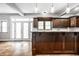 Kitchen with dark wood cabinets and a view of backyard at 814 E 23Rd St, Indianapolis, IN 46205