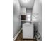 Convenient laundry room with washer, dryer, and shelving at 814 E 23Rd St, Indianapolis, IN 46205
