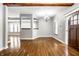 Dining room with hardwood floors and a view into the living room at 814 E 23Rd St, Indianapolis, IN 46205