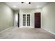 Bedroom with carpet, double doors to closet, and access to bathroom at 814 E 23Rd St, Indianapolis, IN 46205