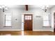 Bright entryway with hardwood floors and a wood door at 814 E 23Rd St, Indianapolis, IN 46205