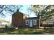 Rear view of brick home with small addition at 7716-7718 Michigan Rd, Indianapolis, IN 46268