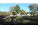 Vacant lot with overgrown vegetation at 7716-7718 Michigan Rd, Indianapolis, IN 46268