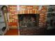 Brick fireplace with decorative mantle and hearth at 7716-7718 Michigan Rd, Indianapolis, IN 46268