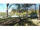 Backyard with trees, white fence, and landscaping at 7716-7718 Michigan Rd, Indianapolis, IN 46268