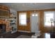 Living room with fireplace, bookshelves, and two windows at 7716-7718 Michigan Rd, Indianapolis, IN 46268