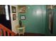 Hallway with green walls and framed artwork at 7716-7718 Michigan Rd, Indianapolis, IN 46268