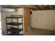 Basement with shelving unit and storage area at 7716-7718 Michigan Rd, Indianapolis, IN 46268