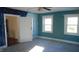 Spacious bedroom with two windows and neutral walls at 7716-7718 Michigan Rd, Indianapolis, IN 46268