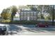 Brick two-story house with white trim and a fenced yard at 7716-7718 Michigan Rd, Indianapolis, IN 46268
