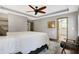 Spacious bedroom with ceiling fan, ensuite bathroom access, and a walk-in closet at 6828 Morningstar Dr, Morgantown, IN 46160
