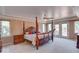 Spacious main bedroom with a large four-poster bed and access to a deck at 1957 Cherry Tree Rd, Avon, IN 46123