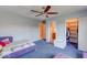 Bedroom with purple bed, and access to a bathroom and walk-in closet at 1957 Cherry Tree Rd, Avon, IN 46123