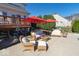 Relaxing patio with wicker furniture and red umbrellas at 1957 Cherry Tree Rd, Avon, IN 46123
