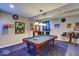 Game room with pool table, comfortable seating and sports memorabilia at 1957 Cherry Tree Rd, Avon, IN 46123