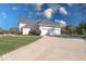 Three-car garage and driveway of a large house at 1957 Cherry Tree Rd, Avon, IN 46123