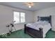 Cozy bedroom with a double bed and green carpeting at 1957 Cherry Tree Rd, Avon, IN 46123