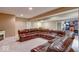 Spacious finished basement with sectional leather sofa at 1957 Cherry Tree Rd, Avon, IN 46123