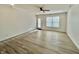 Spacious living room with wood-look floors and a ceiling fan at 1441 Coen Ct, Columbus, IN 47201